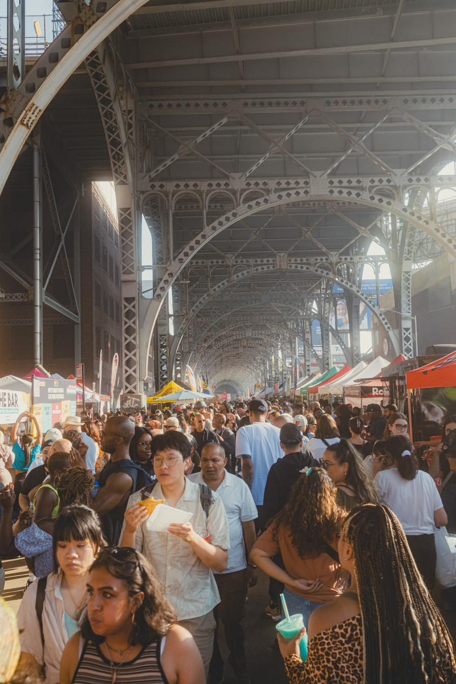 Crowd packed under the arches at night