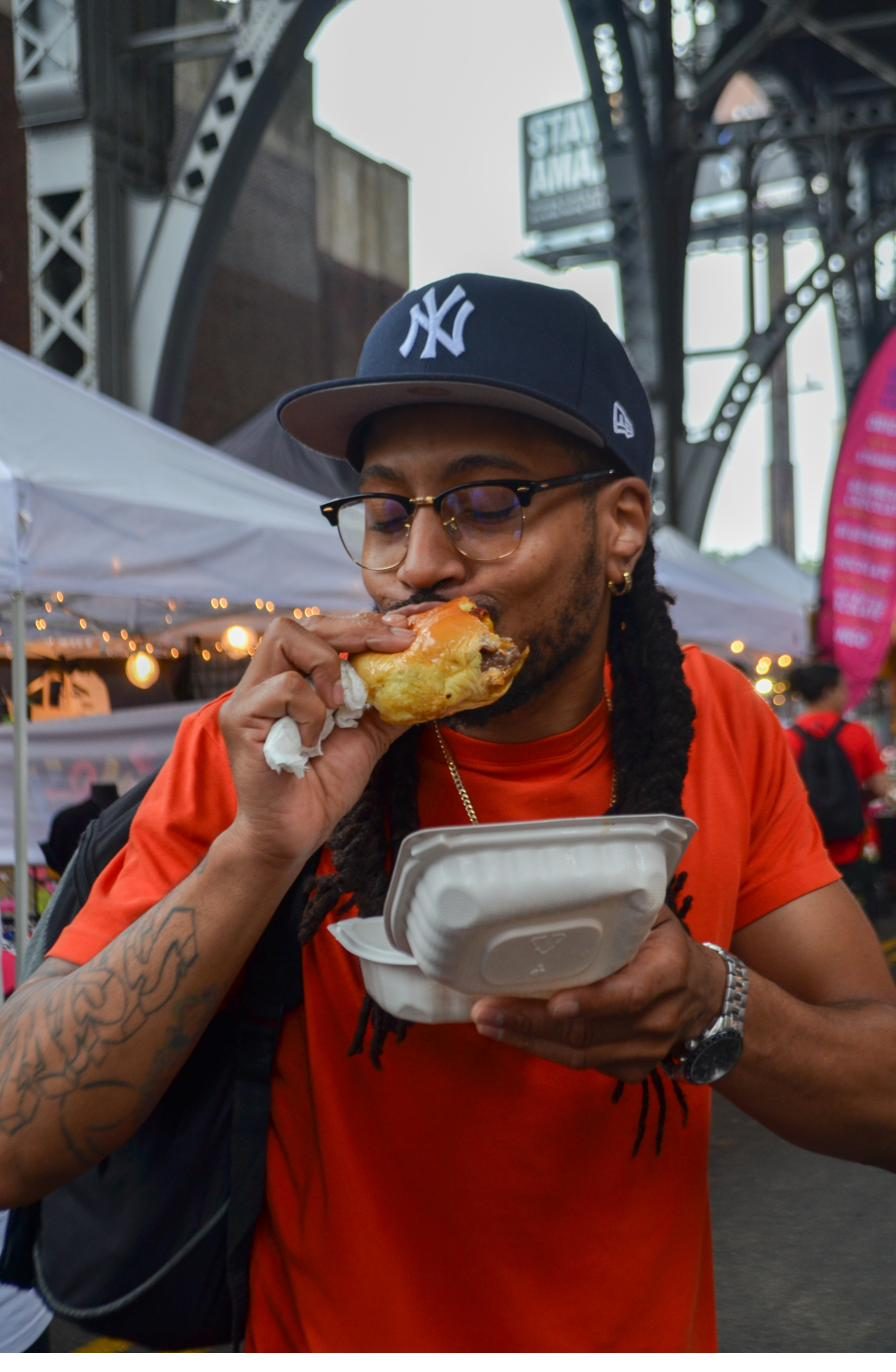 Guest in a Yankees cap eating
